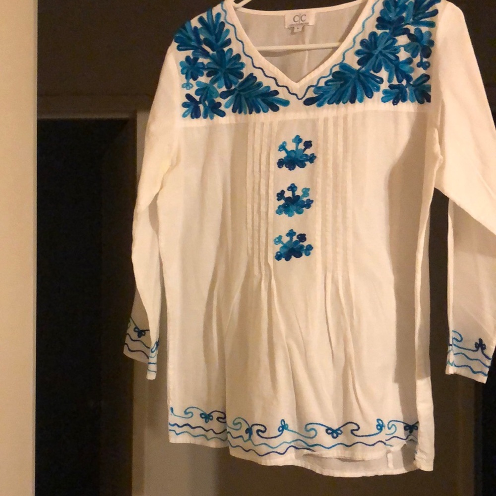 White shirt with blue flower design no damages no rips or stains only worn once!